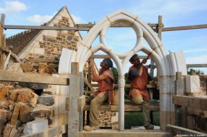 Volunteers working on the medieval Guédelon castle windows