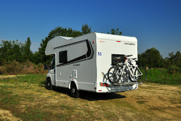 A motorhome with bikes on the back