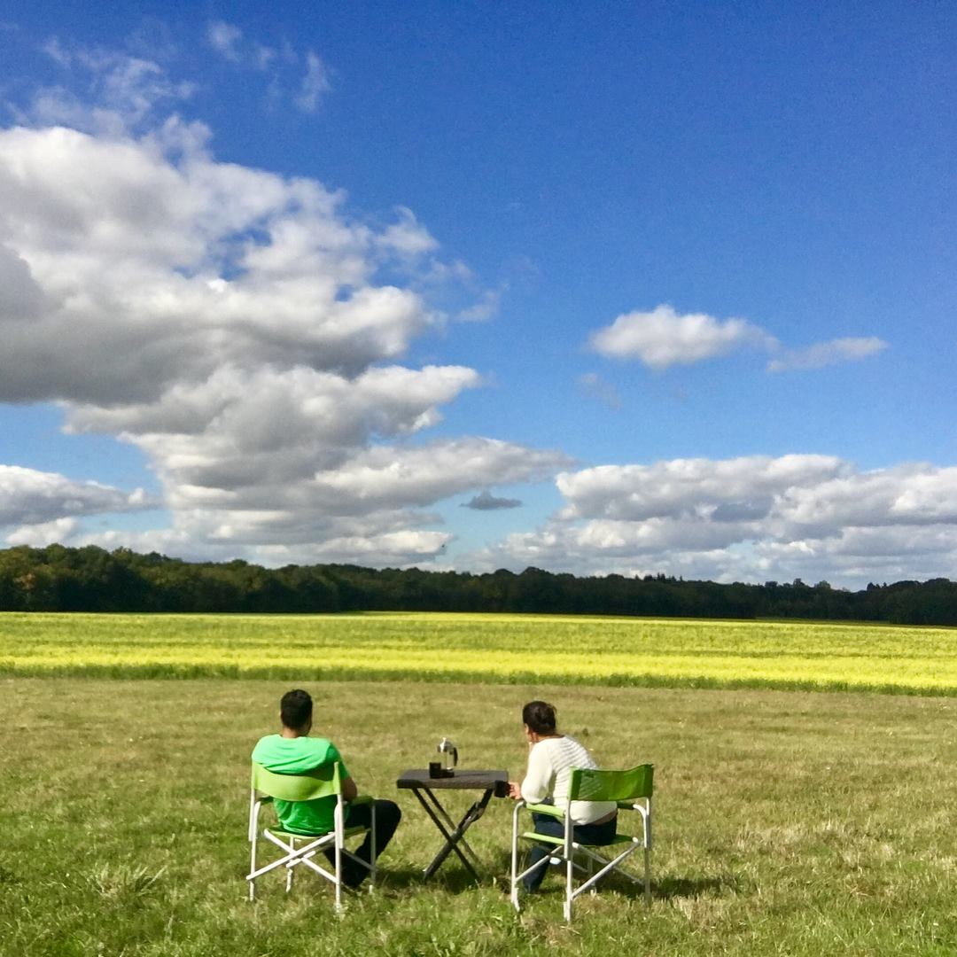 Two people sitting on camping chairs in the Loire Valley